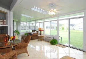 inside-sunrooms-interior-with-rattan-furniture-and-ceiling-fans-with-lights